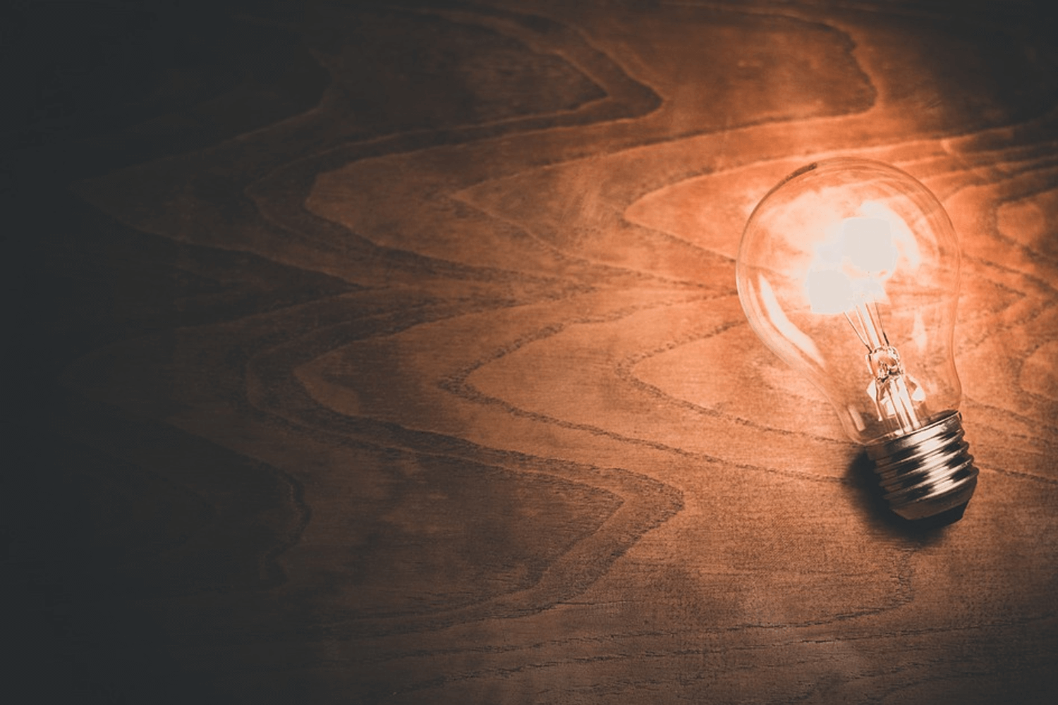 Lightbulb lit up on desk